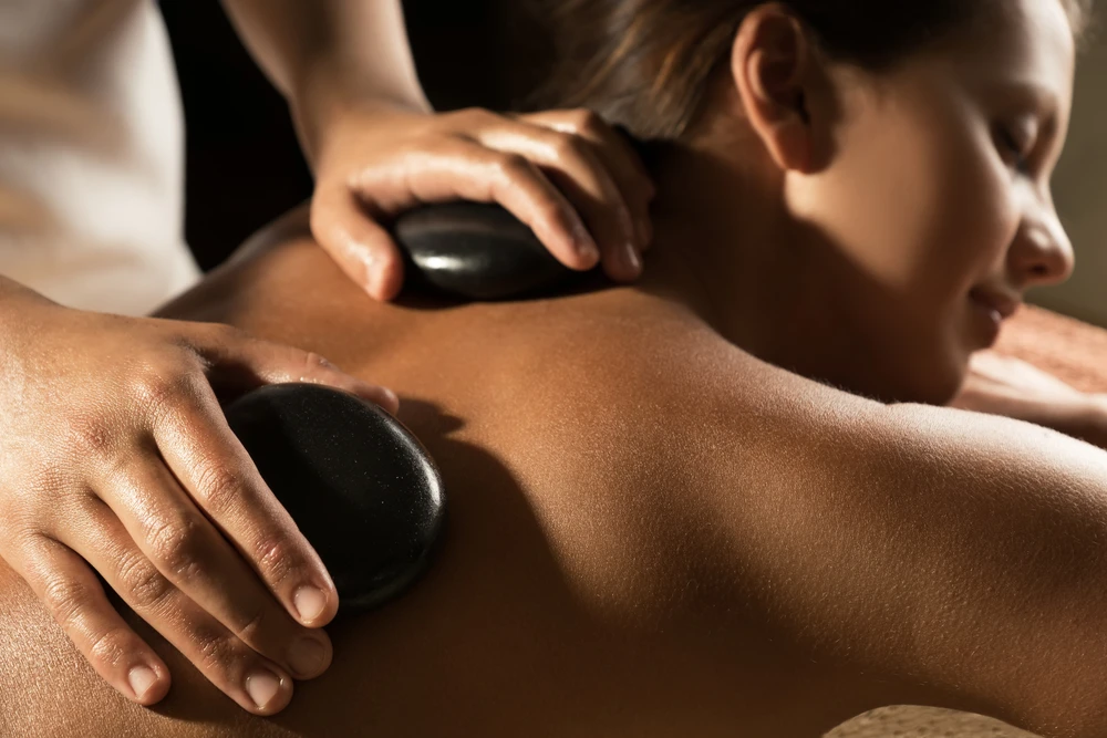 How Hot Stone Massage Reduces Stress and Improves Wellbeing in Edmonton