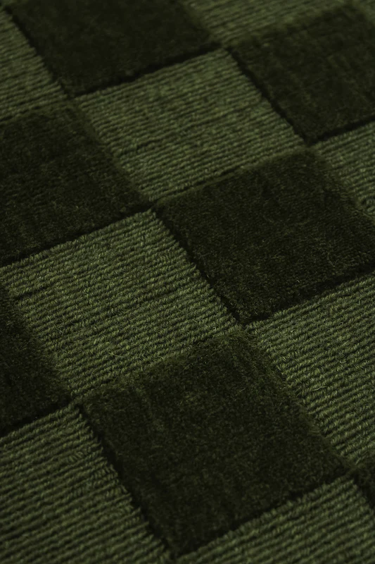 Hva gjør et ensfarget ullteppe perfekt for hjemmet ditt?