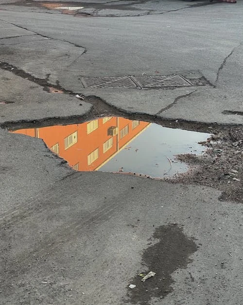 The Hidden Cost of Ignoring That Pothole in Your Parking Lot