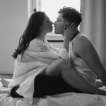 A romantic couple on a bed