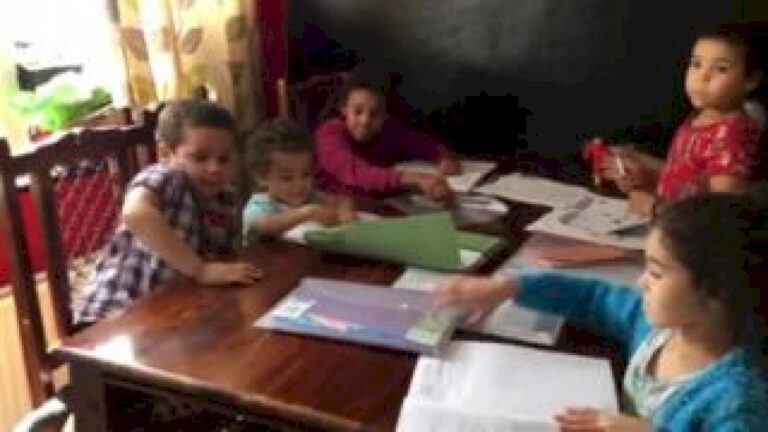 Digital divide: Six children sharing one phone for homework