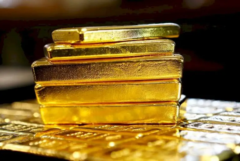 Gold Up Over Weaker Dollar, But Gains Capped By Signs of Global Economic Recovery