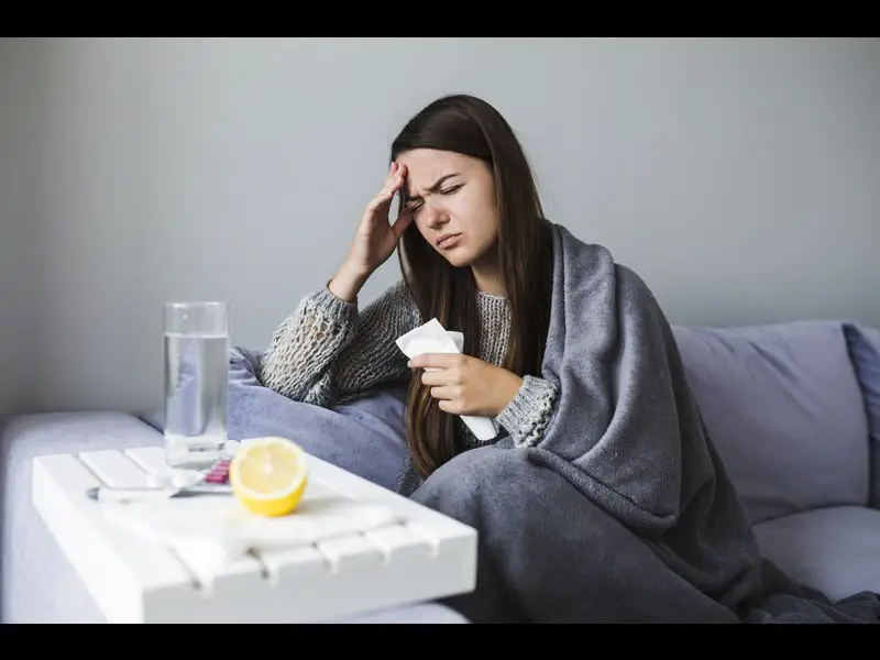 woman-couch-with-medication - kb-3a3e63f5