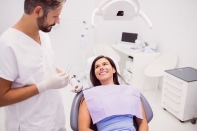 dentist-with-smiling-female-patient(1)