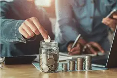 Screenshot 2023-06-29 at 15-54-07 Premium Photo Businesswoman saving money by hand puting coins in jug glass