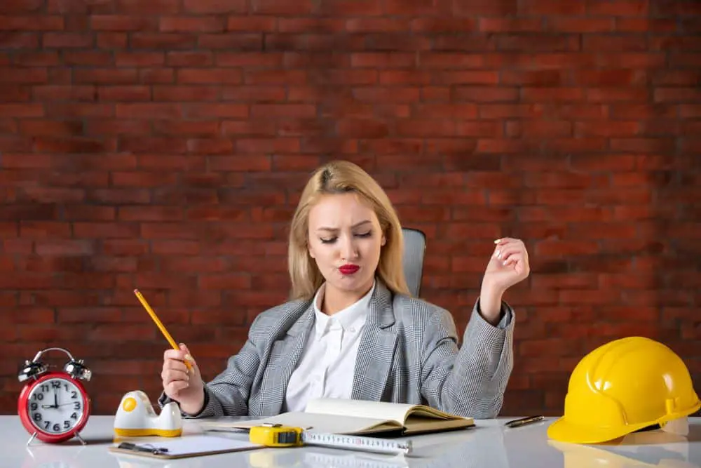 front-view-female-engineer-sitting-her-working-place2