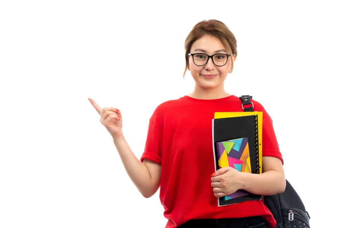 front-view-young-beautiful-lady-red-t-shirt-black-jeans-holding-different-copybooks-files-smiling-with-bag-white1