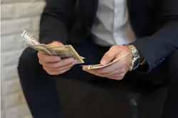 Screenshot 2023-07-18 at 15-05-27 Free Photo Portrait of a businessman holding money and counting it