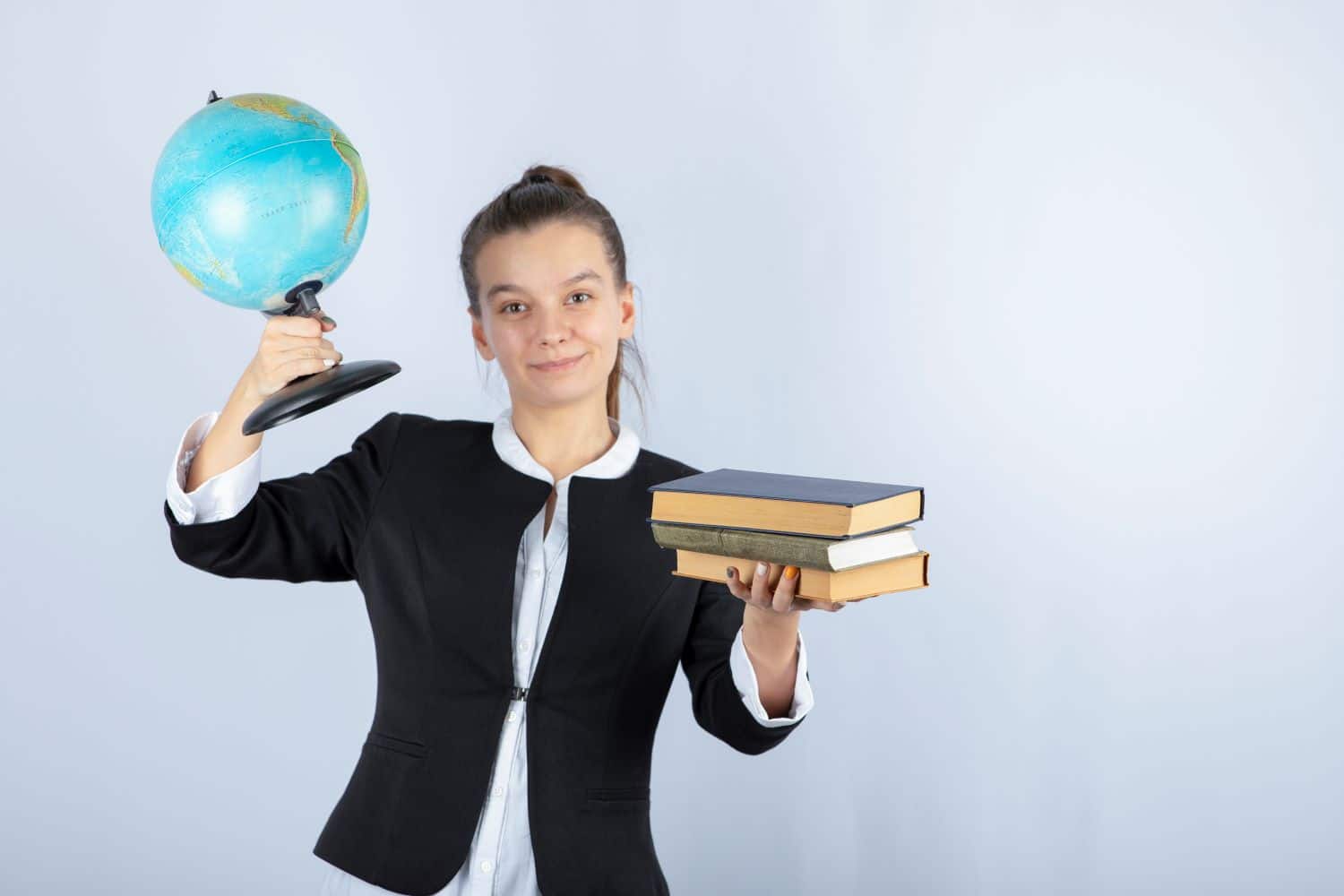 photo-young-teacher-holding-books-globe-white1