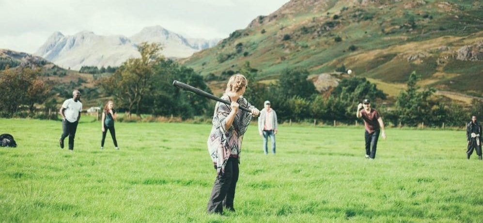 People-playing-rounders-in-countryside-e1573578515579-997x460