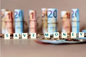 Screenshot 2023-08-08 at 18-28-14 Free Photo Cubes spelling save money on the table with spanish dinero bills and coins