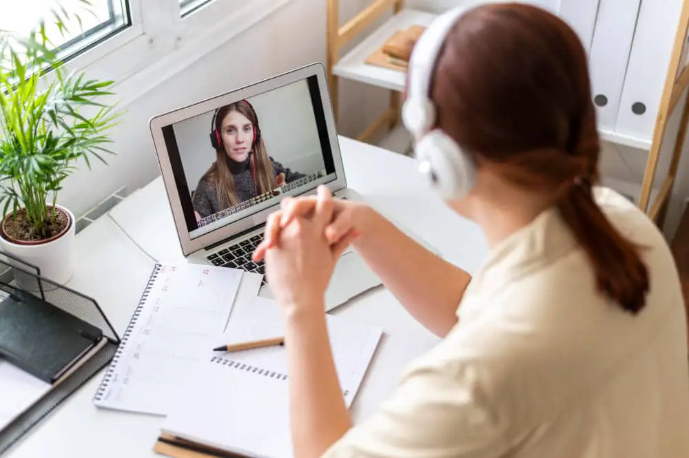 portrait-woman-work-having-video-call-laptop (1)