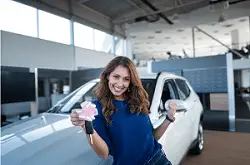 Screenshot 2023-09-14 at 17-41-27 Free Photo Happy beautiful brunette woman holding car keys in front of new vehicle in automobile dealership showroom