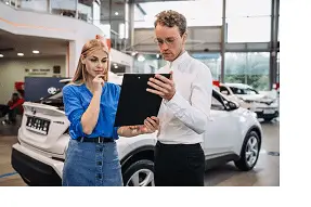 Screenshot 2023-09-20 at 16-42-13 Free Photo Woman choosing a car in a car showroom