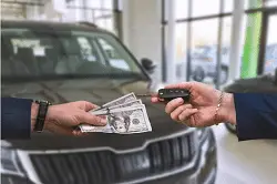 Screenshot 2023-09-26 at 16-46-07 Premium Photo The buyer pays a large sum of dollars for the purchase of a car in one of the city's showrooms the concept of a new grand purchase