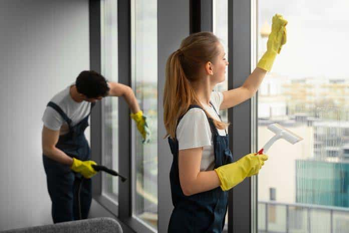 medium-shot-people-cleaning-building-696x464