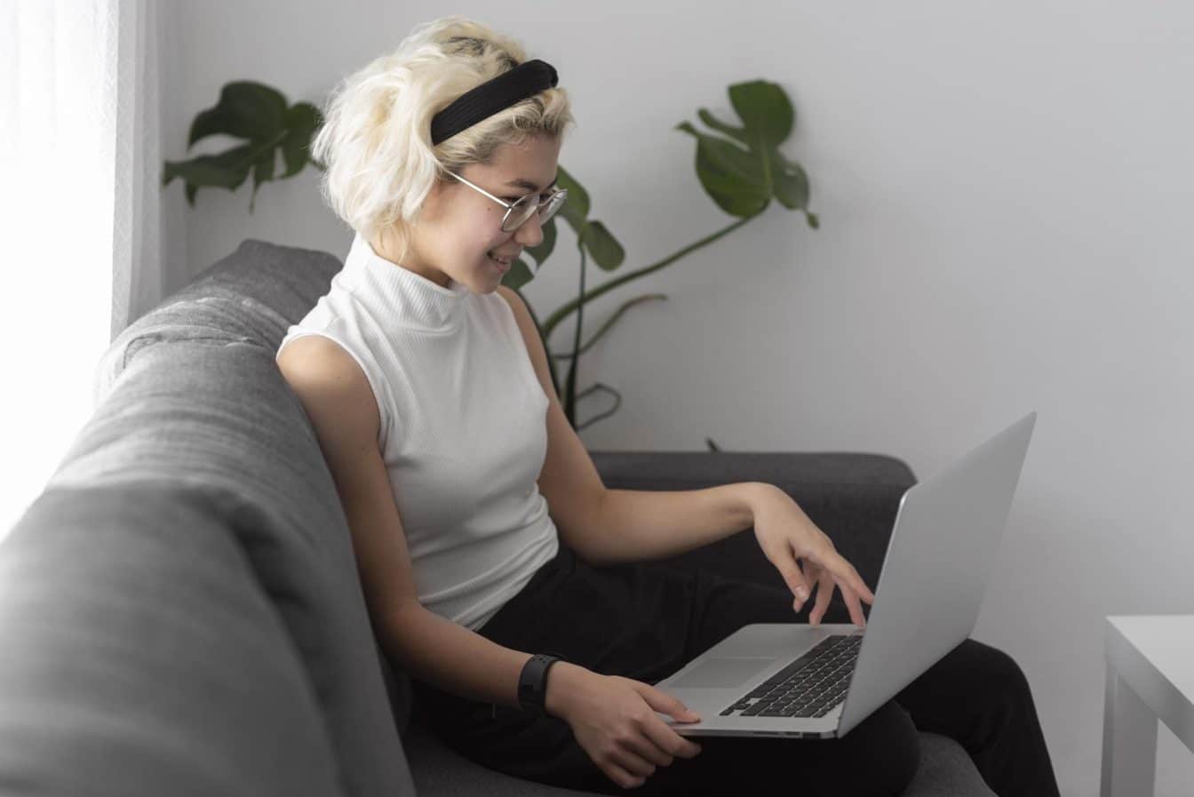 medium-shot-woman-holding-laptop-1344x897