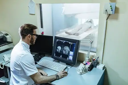 male-radiologist-analyzing-mri-scan-results-patient-computer-monitor-control-room