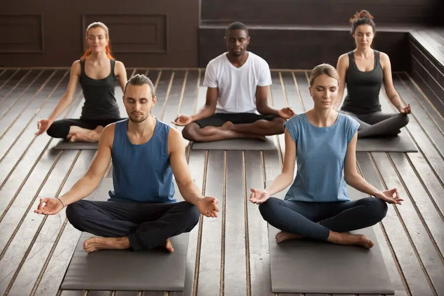 group-young-yogi-people-sitting-sukhasana-exercise_1163-4945 (1)-min