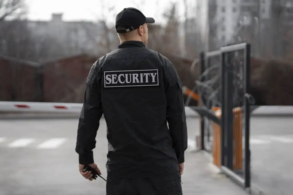 portrait-Security companies Australiamale-security-guard-with-barbed-wire-fence-1024x683