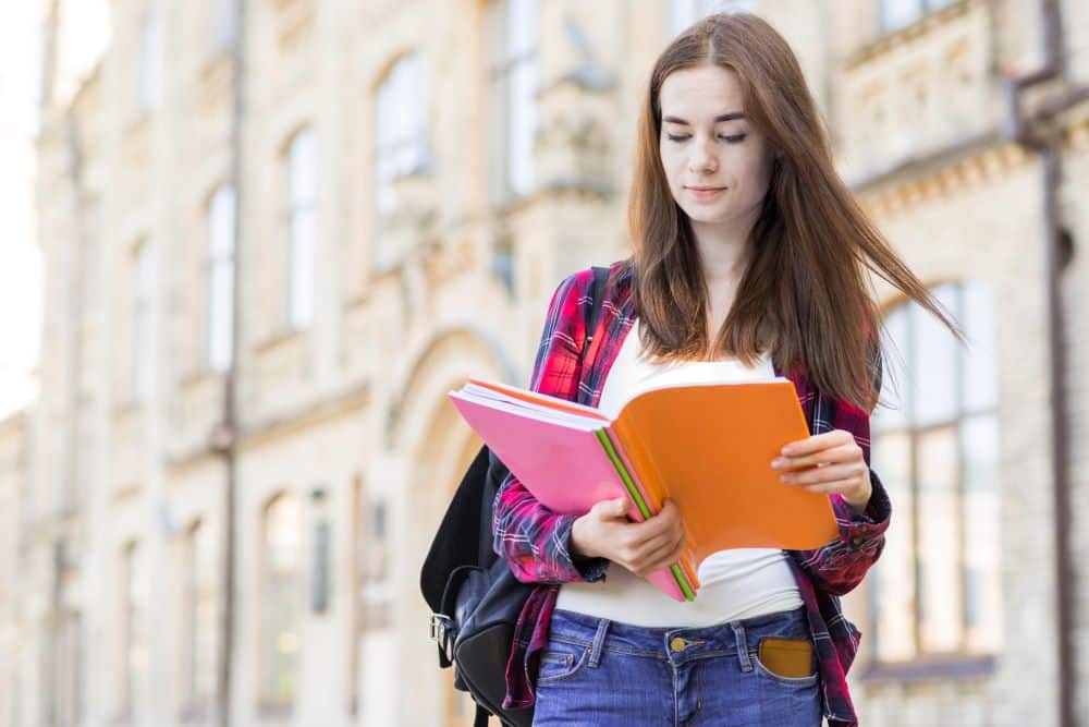 portrait-school-girl-with-book-city1