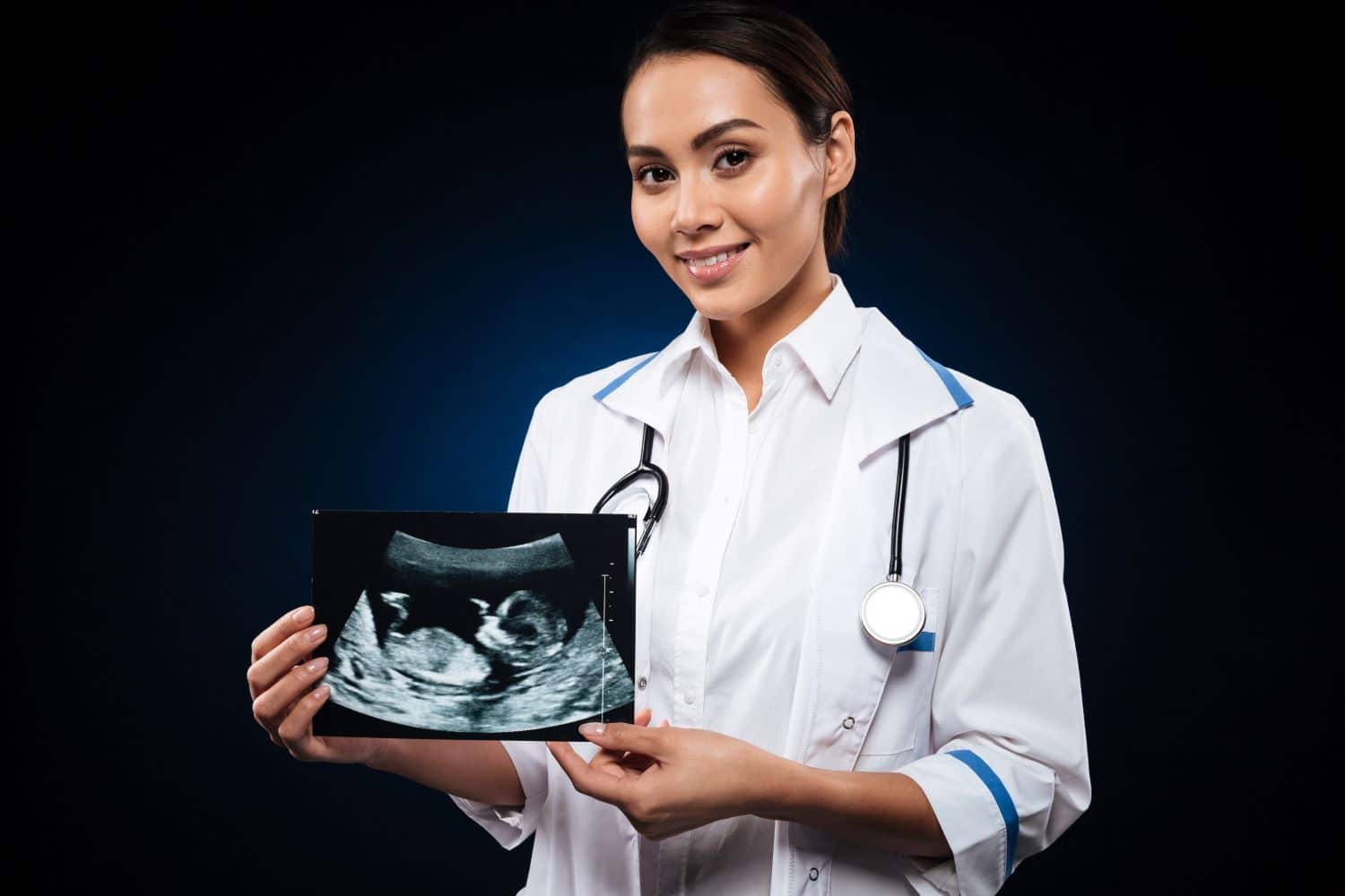 young-cheerful-doctor-holding-ultrasound-scan-baby1