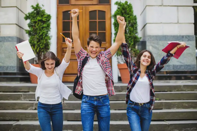 cheerful-students-celebrating..